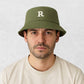 Un homme porte Bob de Golfer Vert 