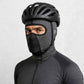 Un homme porte la Cagoule Courte de Vélo Grise