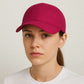 Une femme porte la Casquette Course à Pied Femme