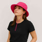 Une femme porte le Chapeau Femme Été Fushia